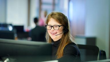 An office worker wearing a headset.