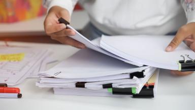 An office worker sorting through files.