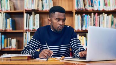 A student studying in a library.