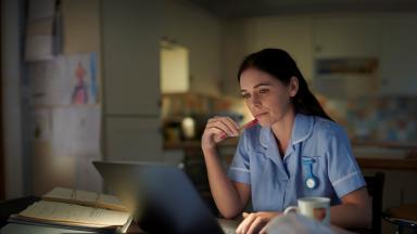 Image of lady looking at her laptop