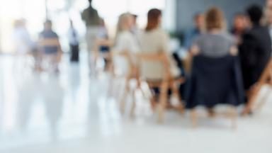 Image of delegates listening to a presentation