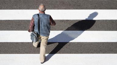 Man walking across crossing