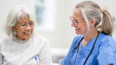 Patient and doctor smiling