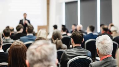 Speaker at a conference - banner