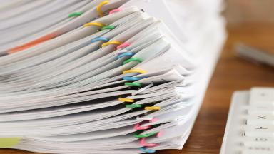 Stack-of-papers-and-calculator-hero-banner.jpg