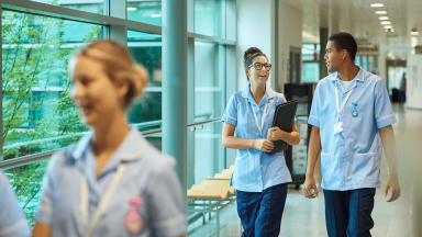 three nurses walking