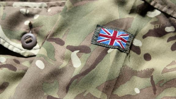 A close up of the British Army uniform, with a UK flag sewn on.
