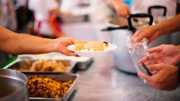 Someone being served canteen food.