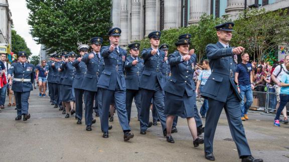 A diverse military group, marching.