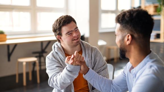 A handshake between two colleagues at an interview.