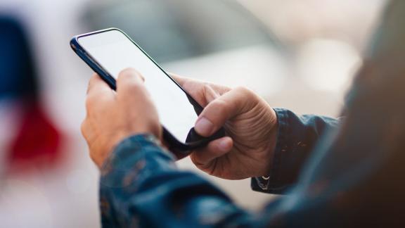 A close up of a person using a mobile phone.