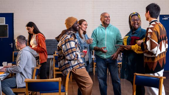 A diverse group of colleagues holding an informal meeting.