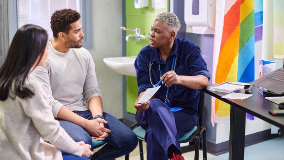 A doctor talking to a couple