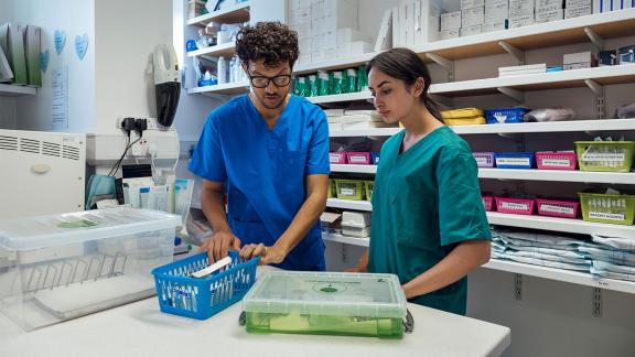 Student and colleague discussing medical equipment