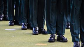 A close up of a row of military personnel.