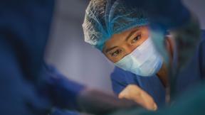 A surgeon concentrating mid-surgery.