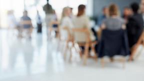 Image of delegates listening to a presentation