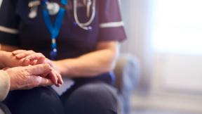 A nurse showing compassion to a patient. 