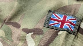 A close up of the British Army uniform, with a UK flag sewn on.