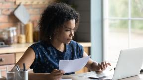 A person working from home at their kitchen table.