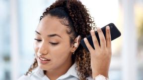 Office worker using hearing aid