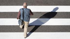 Man walking across crossing