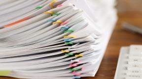 Stack-of-papers-and-calculator-hero-banner.jpg
