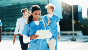 A nurse walking outside