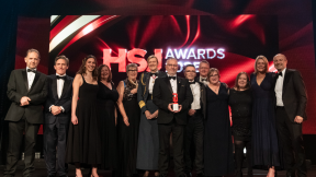 The team from ESHT receive their HSJ award from Rob Brydon