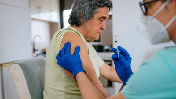 An elderly patient receiving a COVID-19 vaccination.