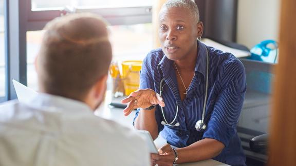 A doctor consulting a patient.