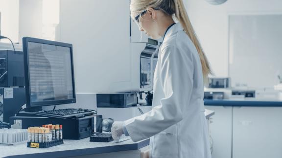 A healthcare scientist checking samples.