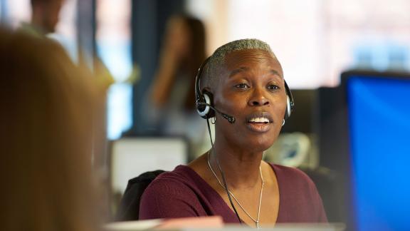 An office worker wearing a headset.