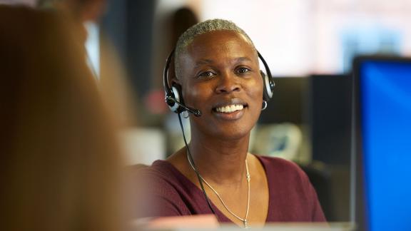 An office worker wearing a headset.