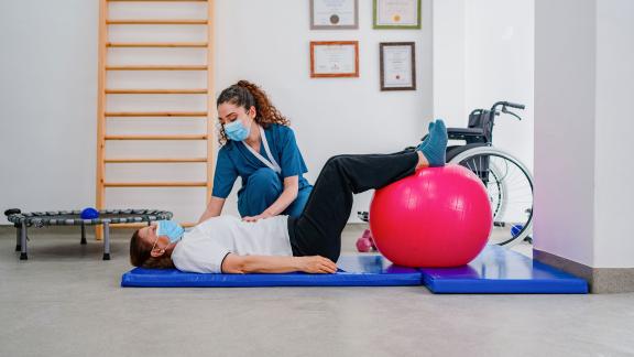 A physiotherapist and patient mid-session.