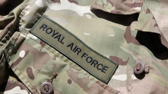 A close up of a uniform badge reading "ROYAL AIR FORCE".