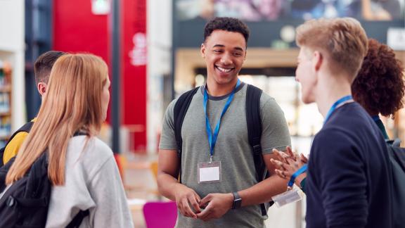 A diverse group of young delegates at a conference.