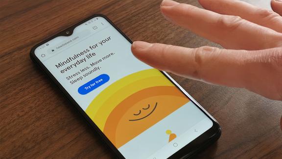 A phone open on the Headspace app