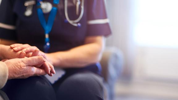 A nurse showing compassion to a patient. 