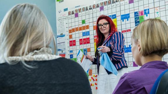 Image of lady presenting to two people