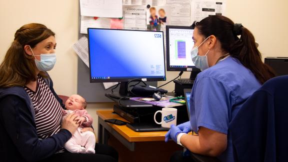 Mother and baby with maternity nurse