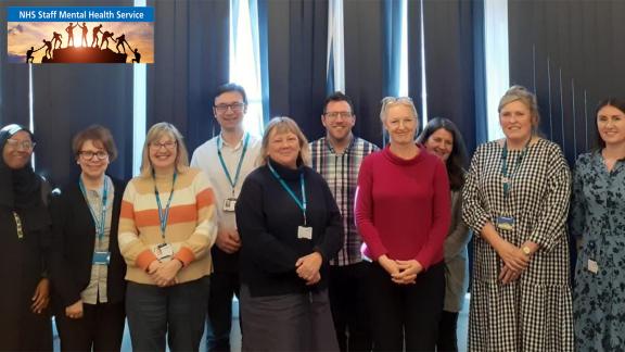 A team photo of the NHS Staff Mental Health Service. Featuring the NHS SMHS logo in the top left hand corner.