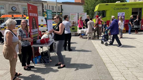 A group of people talking at a careers roadshow