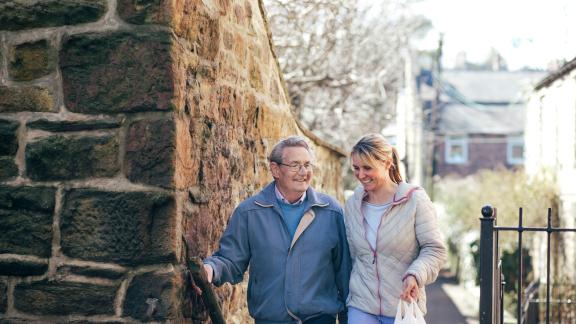 Carer and relative, walking