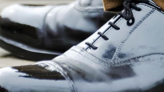Featuring a polished pair of Army boots