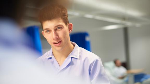 A trainee nurse in conversation.