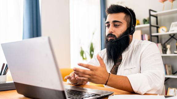 Homeworker wearing headset