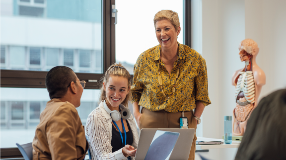 three people in an office setting.png