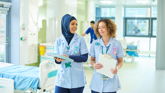 Two nurses with files