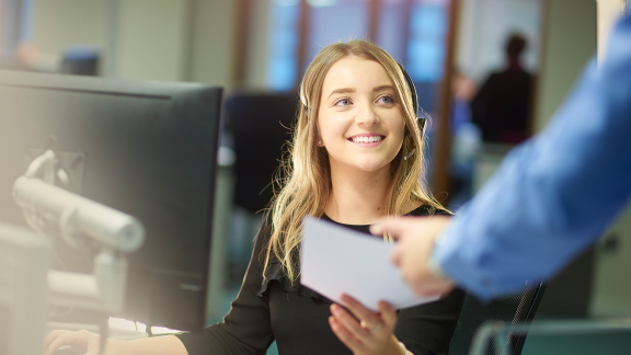 Woman receives paper file